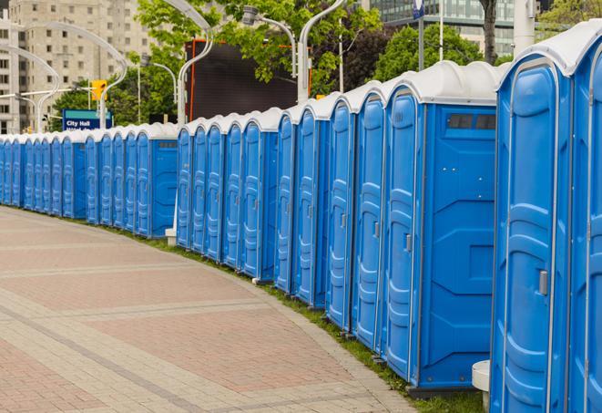 a row of portable restrooms at an outdoor special event, ready for use in Atascadero